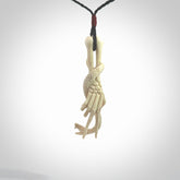 Hand carved deer antler skeleton hand with snake pendant. Hand carved by NZ Pacific. Free postage worldwide. Hand made skeleton hand with snake necklace from deer antler. Skeleton hand with snake necklace for men and women.